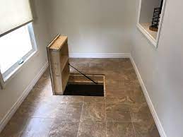 It can't be a crawl space because there's no ladder. Porcelain Tile And Trap Door In Front Entry Hammerdown Home Improvement Serving Durham Region And Surrounding Area