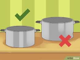 Some simple organizing racks can help keep cookware in place inside your cabinets. How To Organize The Pots And Pans Cabinet 11 Steps