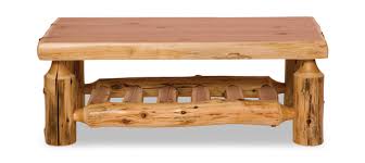 Made from large cedar logs sawn in half and skillfully fitted together, this table is sure to please the most discriminating decorator. White Cedar Log Coffee Table Hom Furniture