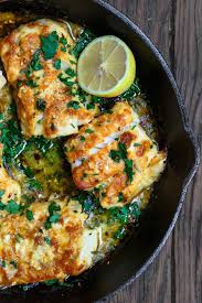 Prepared Greek Style With A Few Spices And A Mixture Of Lemon Juice Olive Oil And Lots Of Garlic Bakes Cod Recipe Lemon Seafood Recipes Mediterranean Recipes