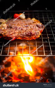 Consider using tongs when flipping to prevent piercing the meat. Grilling T Bone Steak On Flaming Grill In 2021 Grilled T Bone Steak T Bone Steak Steak