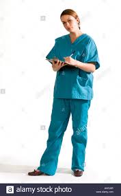 Female Nurse In Scrubs Full Body Holding Patient Chart Stock
