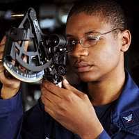 Quartermaster 3rd Class Jaren Briggs uses a statometer to measure range  during an underway replenishment aboard the guided-missile cruiser USS  Leyte Gulf (CG 55).