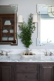 Green bathroom ideas image via lime green and yellow. Chocolate Brown Bath Cabinets With Brass Wall Sconces Transitional Bathroom