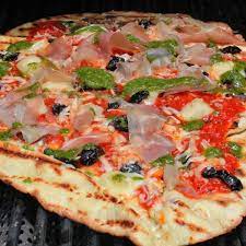 Grilled Pizza With Taleggio Prosciutto Pesto And Olives Recipe Emeril Recipes Grilled Pizza Grilling Recipes