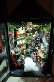 The christmas tree is topped with a lighted cherub with a golden halo wearing white silk robes and a gold sash. With Light Nims Christmas Lanterns Christmas Shadow Boxes Christmas Scenes
