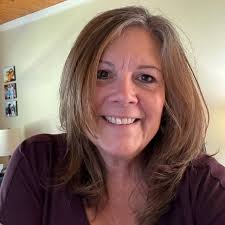 If she wants Batman give her Batman. Kids like what they like. Girls can  like Batman and superheroes. It isn't weird. I work in Prek and boys and  girls like superheroes, playing