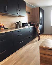 black kitchen inspiration great use of materials the black cupboard combined with modern kitchen design wood tile floor kitchen interior design kitchen small