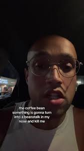 Guy in Store Eating Coffee Beans