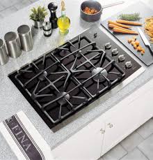 Finally, since the flat surface of the range can be used as a countertop when the range is off, the chances of accidentally leaving something on the stove and turning on the range are increased. Ge Jgp940sekss 30 Inch Gas Cooktop With 4 Sealed Burners Powerboil 15 000 Btu Burner Precise Simmer Burners Ceramic Glass Cooktop Control Lock Capability Ge Fits Guarantee And Ada Compliant Black Surface With
