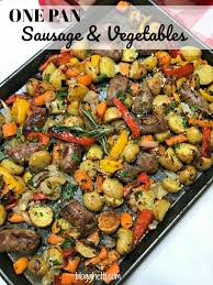 A One Pan Meal Of Italian Sausages Carrots Potaotes Onions And Bell Peppers All Roasted In The Oven W Italian Sausage Recipes Italian Sausage Baked Veggies