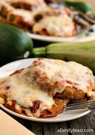 A coworker gave my husband a massive zucchini from his garden. Zucchini Parmesan A Family Feast Vegetarian Dishes Cooking Recipes Food