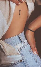 30 Simple And Small Flower Tattoos Ideas For Women Rose Rib Tattoos Tattoos Rib Tattoo