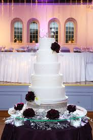 Maybe you would like to learn more about one of these? Ivory Wedding Cake With Plum Flowers