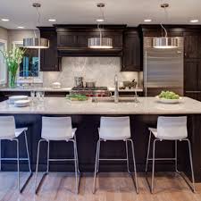 If you're looking for a unique way to bring your kitchen or bathroom design to completion, consider adding a dark quartz countertop to the room. Dark Cabinets Light Countertop Houzz