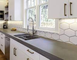 When the machine is on, position it on top of the concrete countertop and allow it to remove a thin portion of the top surface. Concrete Countertops Cement Elegance Oregon