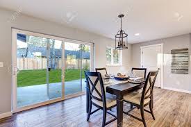 The dining room floors are done and we're in love! Open Plan Dining Room Interior With Light Wood Floors Showcases A Black Dining Table Set And Sliding Doors To Fenced Backyard Northwest Usa Stock Photo Picture And Royalty Free Image Image 72005074