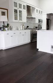 Dark floors, gray walls, white trim. European White Oak Installation Tamalpais Hardwood Floors White Kitchen Dark Floors Dark Kitchen Floors Dark Brown Floor