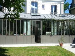 Les Verandas Pas Si Has Been Que Ca Elle Decoration Maison Toit Terrasse Veranda Minimaliste Vie Et Veranda