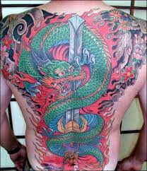 Examples Of Popular Dragon Tattoo Designs And Placements Dragon Tattoos For Men Sword Tattoo Back Tattoos For Guys