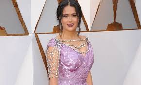 German formula one driver sebastian vettel, mexican actress salma hayek, wearing a traditional bavarian dirndl dress, and german fashion designer. Salma Hayek S Best Red Carpet Looks Mamaslatinas Com