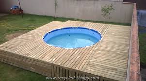 Www Recycled Things Com Wp Content Uploads 2016 09 Pallet Patio Swimming Pool Jpg Diy Swimming Pool Pool Landscaping Swimming Pool Decks