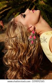 Use styling serums when your hair is wet and scrunch at the crown of your head, near the root of your hair to add more volume at the top. Closeup Of Blond Woman With Long Wet Curly Hair Wearing Pink Lipstick And Gold And Pink Neon Earrings In Summer Sun Stock Images Page Everypixel