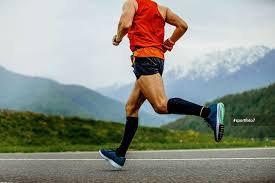 Running Man Athlete Compression Socks On Background Mountains And Green Forest Marathon Training Running Compression Socks