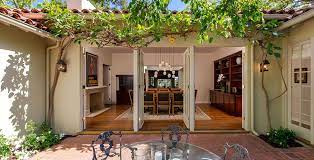 The time honored popularity of the palladian window is beautifully showcased in this mediterranean home. U Shaped House Plans With Central Courtyard Google Search Courtyard House Plans Spanish Style Homes Celebrity Houses