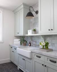 Pale Gray Laundry Cabinets With Farmhouse Sink Grey Laundry Rooms Laundry Room Cabinets Laundry Room Lighting