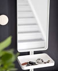 A Mirror And Small White Tray Containing Keys And Coins Against A Black Wall Ikea Storage Boxes With Lids Clever Storage