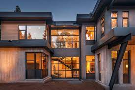 It features a more traditional exterior and a blend of modern and classic touches throughout the interior. Interior Design Home Decor Windows Architecture Houses Homes Window Design Large Windows Modern House