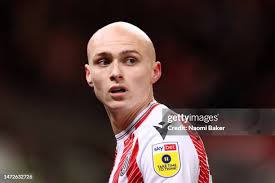 Ryan Hedges of Blackburn Rovers battles for the ball with Morgan Fox...  News Photo