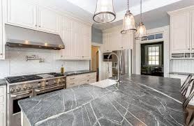 Black displays strength and, here, it lifts the white equally. White Kitchen Cabinets With Dark Countertops Designing Idea