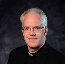 Congratulating the Reverend Father 🙏🏽✝️