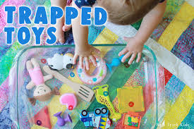 Problem solving games for kids. A Simple And Engaging Problem Solving Activity To Promote Hand Eye Coordination Designed For Babies Toddler Activities Toddler Play Problem Solving Activities