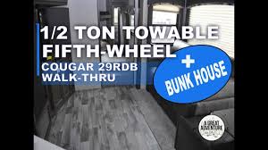 This 42.5 foot behemoth of a 5th wheel has everything from 3 tv's to 3 queen size beds, 1 sofa bench which converts into a queen size bed, a central vacuum system, washer/dryer hook ups, auxiliary gas tank with pump right outside the toy hauler to get fuel to your big boy toys which you can store in the 14 foot garage! 1 2 Ton Towable 5th Wheel With A Bunk House Check Out The Cougar 29rdb Youtube