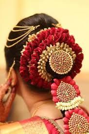 Beautiful young woman's face with orchid flowers. Discover The Trends For South Indian Bridal Hair Jewellery Add That Extra Bit Of Elegance To Your Bridal Look 2020