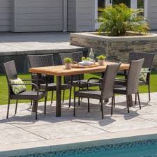 A patio set for six can quickly be arranged to a table for eight. Patio Dining Sets Patio Dining Furniture The Home Depot