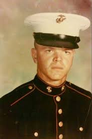 Mike LeFleur carries the flag for his father Michael