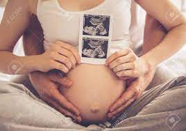 Beautiful pregnancy pictures with husband. Cropped Image Of Beautiful Pregnant Woman And Her Handsome Husband Stock Photo Picture And Royalty Free Image Image 66658454