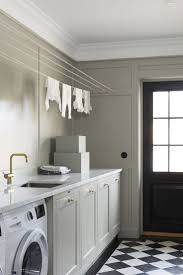 Black And White Checkered Decor Ideas Traditional Laundry Room With Checkered Black And White Tile Flooring Floor To Ceiling W Laundry Room Layouts Laundry Room Storage Shelves Laundry Room Design