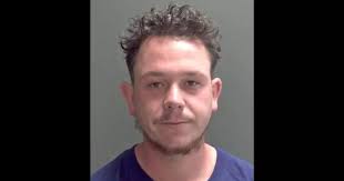 Violent robber pulled woman out of her car and stole it