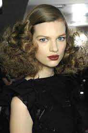 Fall Winter Hairstyle Trends 2013 2014 Slicked Back Voluminous Curls Low Slung Ponytails Gleaming French Twists Combed Up Blow Outs Oversized Ballerina Bu Curly Hair Styles Slicked Back Hair Brushed Out Curls