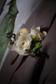 White Ranunculus Boutonniere With White Freesia And Seeded Eucalyptus Accents Ranunculus Boutonniere White Ranunculus Seeded Eucalyptus