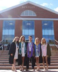 For twins Steve '12 and Don '12 Hopkins (pictured with Waltham Fire Chief Randy  Mullin '96), the firefighter commitment to community is as strong as their  brotherly bond. While they were three-sport