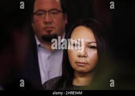 11 year-old girl listens to an iPod Touch alone in the playground of a  neighborhood school in San Jose, CA Stock Photo
