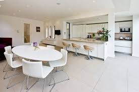 In an open plan kitchen, have a breakfast bar with stools under the kitchen bench for casual meals and promote a more formal vibe around the dining table. How To Zone An Open Plan Kitchen Living Space Property Price Advice