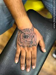 The orange eyes of an owl. Mysterious Owl Tattoos With Hidden Meaning