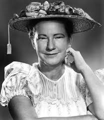 Known for her cheerful shout of “How-DEE! I'm just so proud to be here,''  Minnie Pearl (born Sarah Ophelia Colley) was the undisputed queen of  country comedy. An aspiring actress, Colley settled